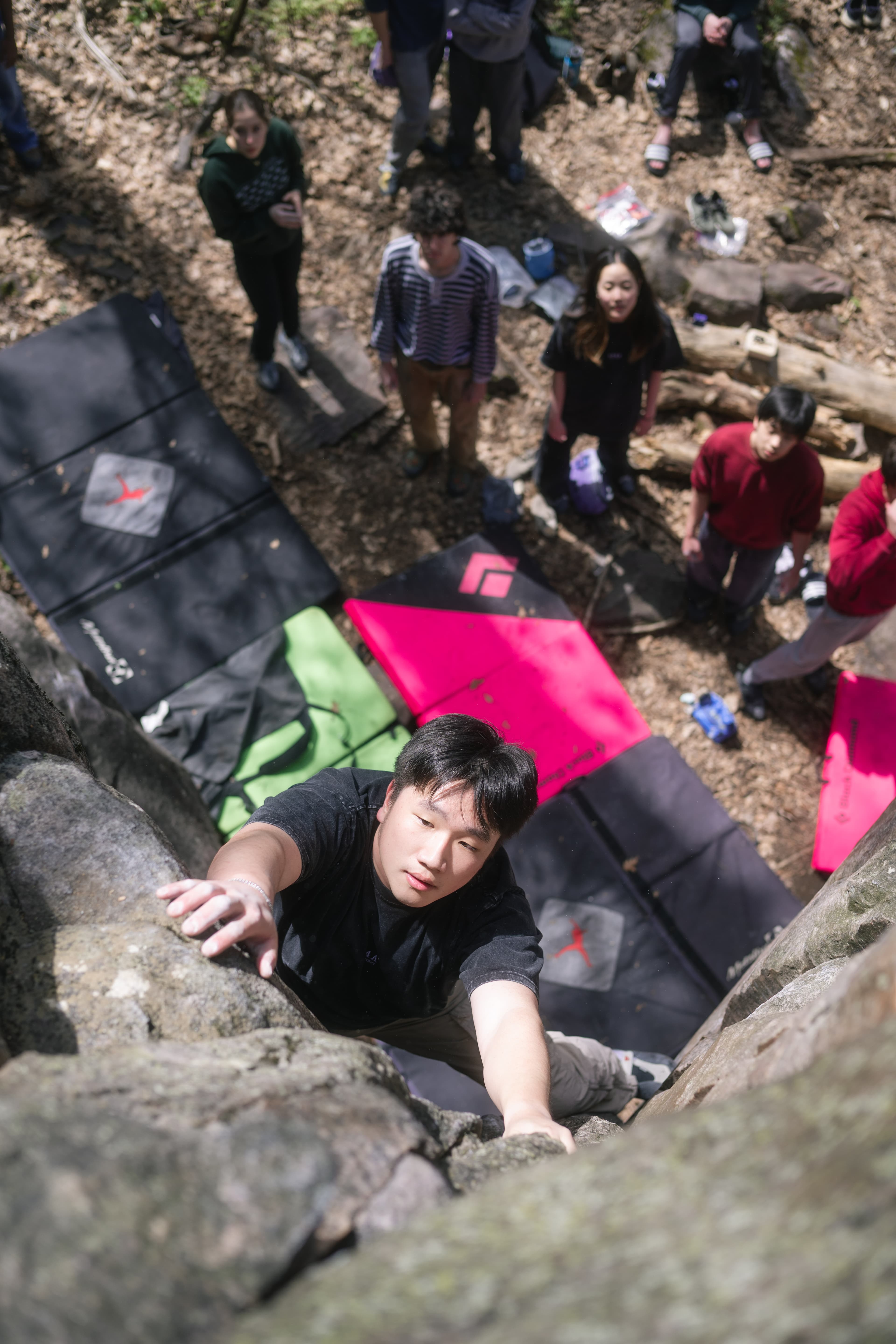 Jovy topping out a boulder